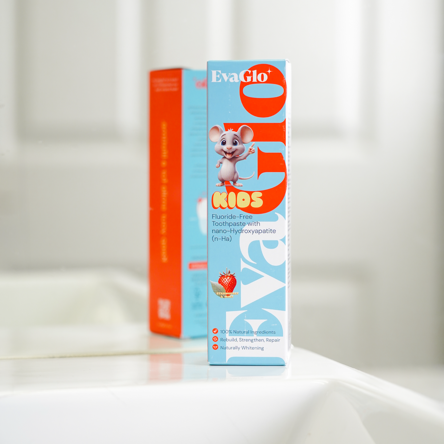 EvaGlo Kids toothpaste box on a white surface with a light gray background